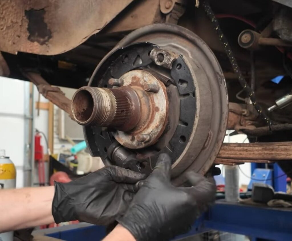 Installing rear brake shoes on an MGB GT